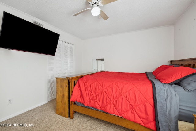 8634 Greatpine Ln W, Jacksonville, FL 32244 - carpeted bedroom with a textured ceiling, visible vents, baseboards, a ceiling fan, and ornamental molding