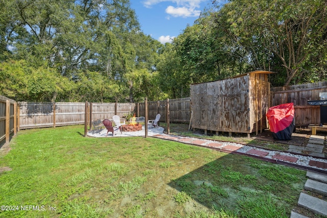 8634 Greatpine Ln W, Jacksonville, FL 32244 - view of yard featuring a fenced backyard and a fire pit