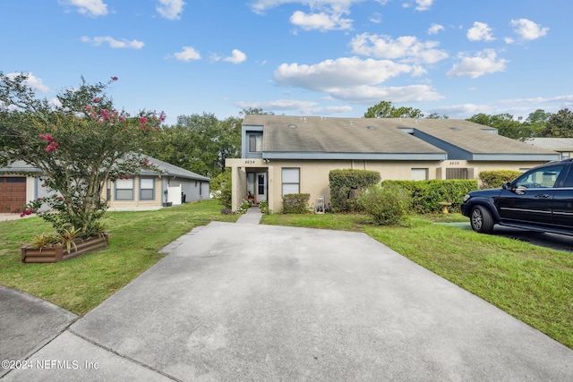 8634 Greatpine Ln W, Jacksonville, FL 32244 - view of front of property featuring stucco siding and a front yard