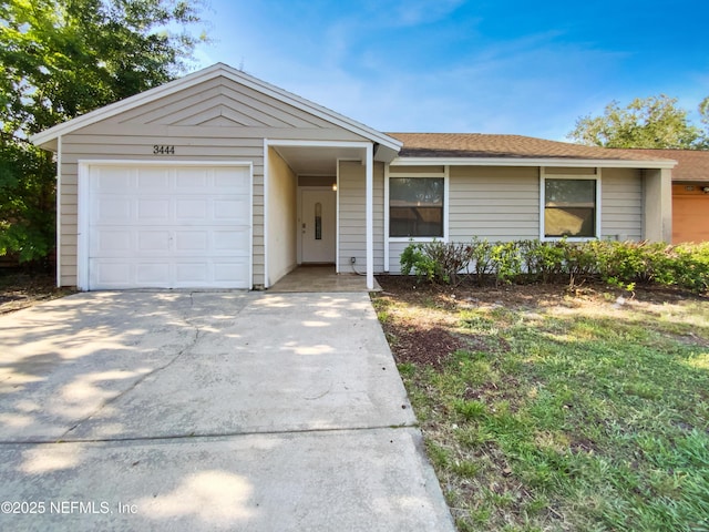3444 Excalibur Way E, Jacksonville, FL 32223 - ranch-style house featuring driveway, a shingled roof, and a garage