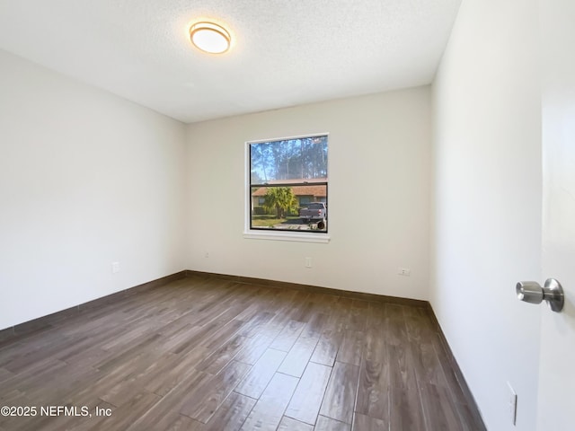 3444 Excalibur Way E, Jacksonville, FL 32223 - unfurnished room featuring baseboards, wood finished floors, and a textured ceiling