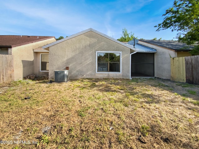 3444 Excalibur Way E, Jacksonville, FL 32223 - rear view of property featuring stucco siding, fence, a yard, and cooling unit