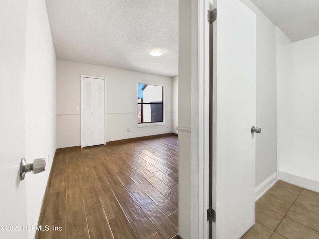 3444 Excalibur Way E, Jacksonville, FL 32223 - interior space with baseboards, wood finished floors, and a textured ceiling