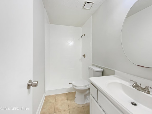 3444 Excalibur Way E, Jacksonville, FL 32223 - full bath featuring a tile shower, tile patterned flooring, toilet, vanity, and baseboards