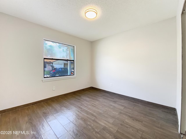 3444 Excalibur Way E, Jacksonville, FL 32223 - unfurnished room featuring baseboards and dark wood-style flooring