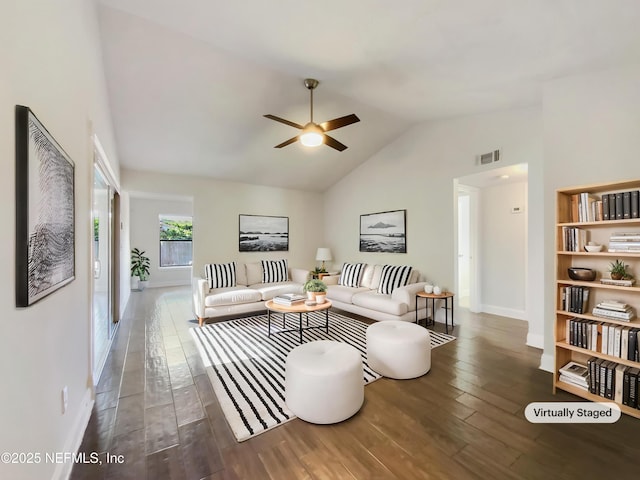 3444 Excalibur Way E, Jacksonville, FL 32223 - living room featuring lofted ceiling, wood finished floors, visible vents, baseboards, and ceiling fan