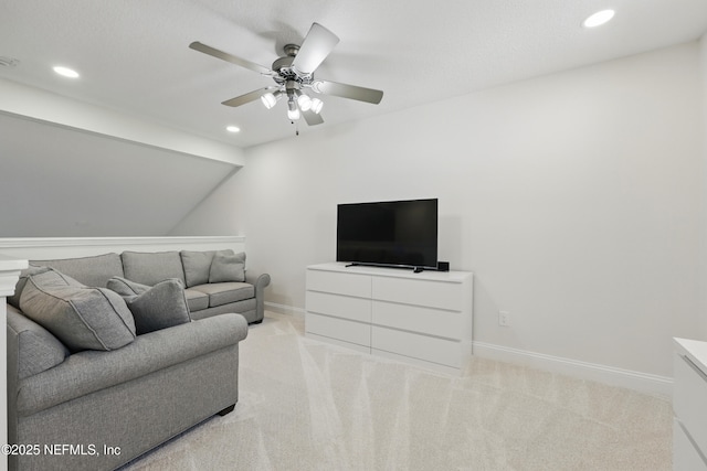 living room with recessed lighting, baseboards, a ceiling fan, and light colored carpet