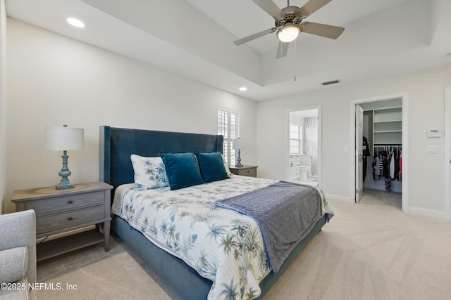 carpeted bedroom with baseboards, visible vents, a spacious closet, and recessed lighting
