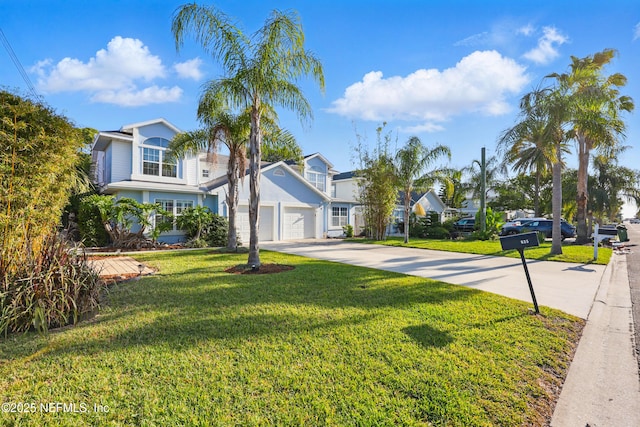 view of front facade with driveway and a front yard