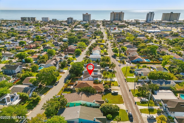 birds eye view of property with a city view, a water view, and a residential view