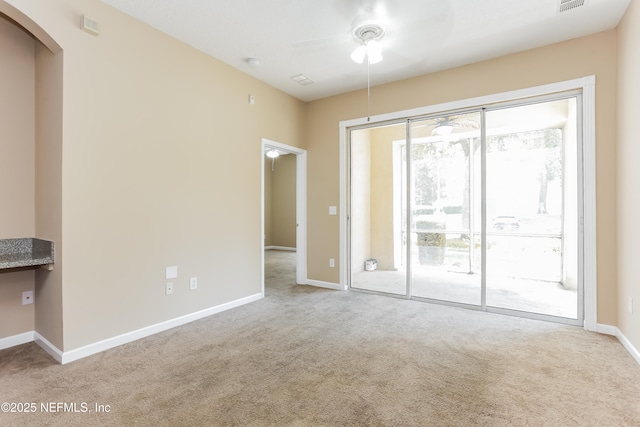 8601 Beach Blvd Unit 1202, Jacksonville, FL 32216 - carpeted spare room with a ceiling fan and baseboards
