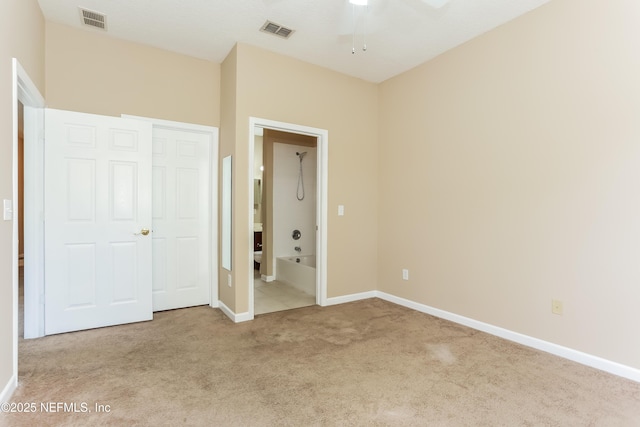 8601 Beach Blvd Unit 1202, Jacksonville, FL 32216 - unfurnished bedroom with carpet floors, baseboards, and connected bathroom