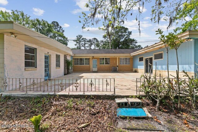 45121 Stratton Rd, Callahan, FL 32011 - rear view of property featuring fence, central air condition unit, and a patio