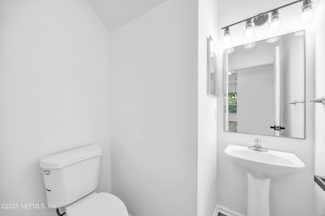 1829 Creekview Dr, Green Cove Springs, FL 32043 - half bath with vaulted ceiling, toilet, and a sink