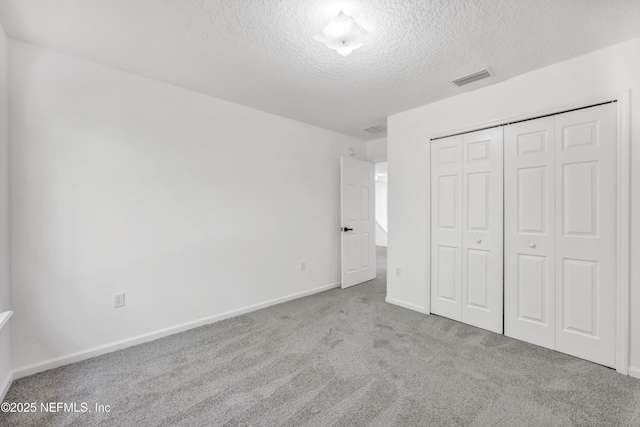 1829 Creekview Dr, Green Cove Springs, FL 32043 - unfurnished bedroom featuring a textured ceiling, a closet, carpet, baseboards, and visible vents
