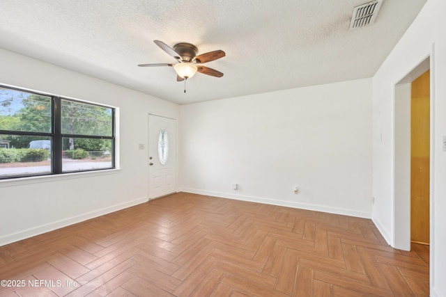 12054 Correa Ct, Jacksonville, FL 32246 - unfurnished room featuring baseboards, a ceiling fan, a textured ceiling, and visible vents