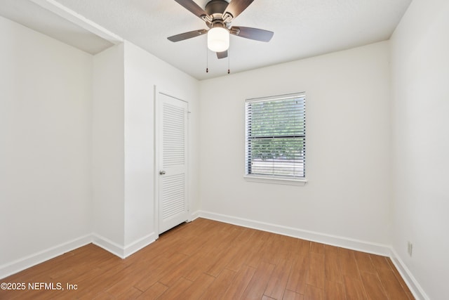 12054 Correa Ct, Jacksonville, FL 32246 - unfurnished bedroom featuring light wood finished floors, baseboards, and ceiling fan