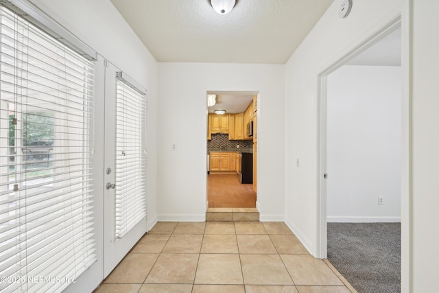 12054 Correa Ct, Jacksonville, FL 32246 - hall featuring baseboards, a textured ceiling, and light tile patterned floors