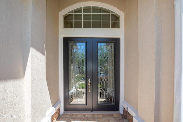 920 Gallier Pl, Jacksonville, FL 32259 - view of exterior entry with stucco siding and french doors