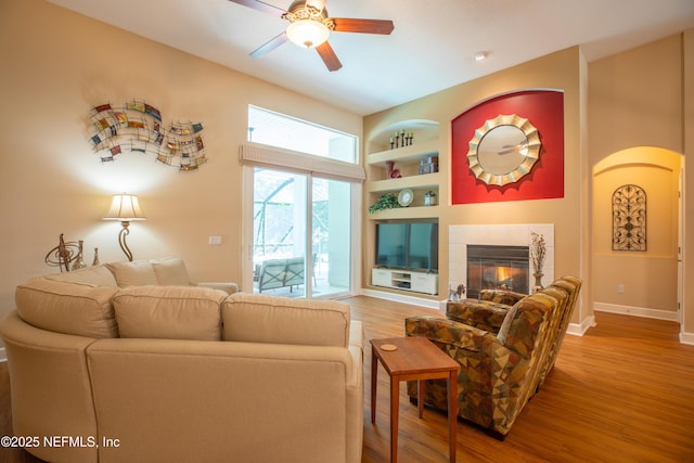 920 Gallier Pl, Jacksonville, FL 32259 - living room with built in shelves, baseboards, a ceiling fan, and wood finished floors