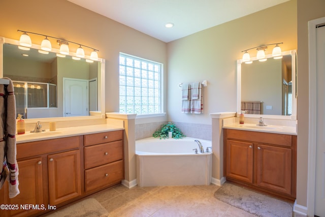 920 Gallier Pl, Jacksonville, FL 32259 - full bathroom featuring two vanities, a garden tub, a stall shower, and a sink