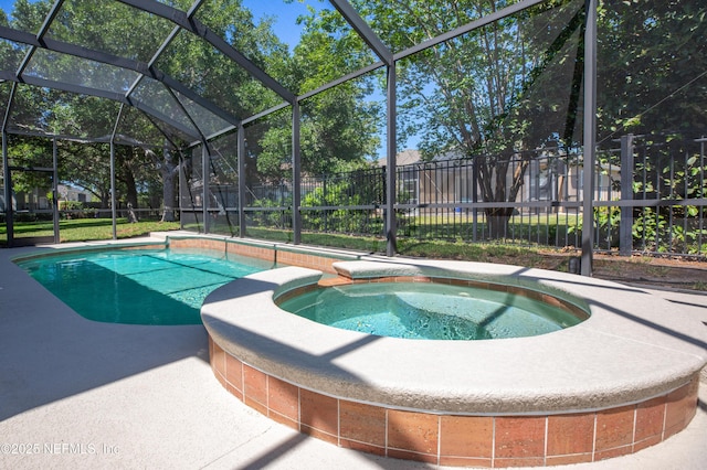 920 Gallier Pl, Jacksonville, FL 32259 - view of swimming pool featuring fence, glass enclosure, and a pool with connected hot tub
