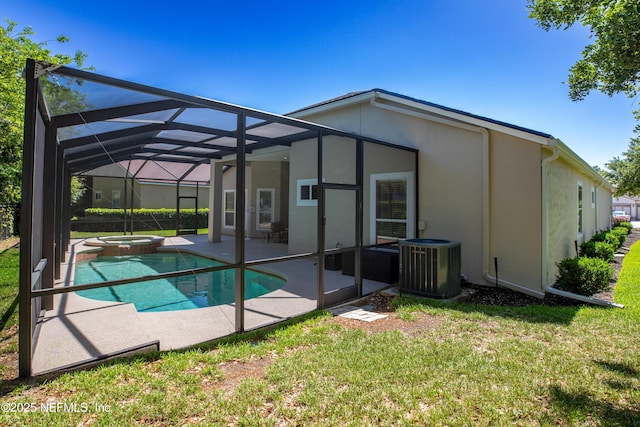 920 Gallier Pl, Jacksonville, FL 32259 - back of property with cooling unit, a lawn, a patio, and stucco siding