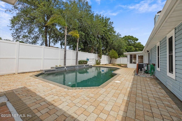 view of pool featuring a fenced backyard, central air condition unit, a patio area, and a fenced in pool