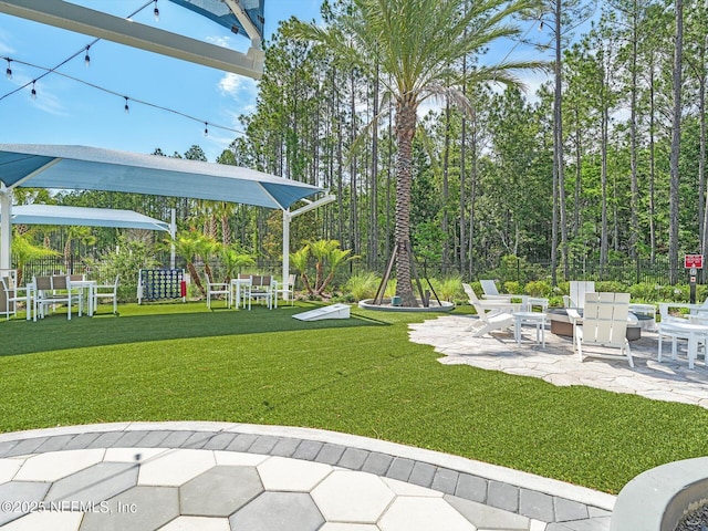 view of yard featuring a patio and fence