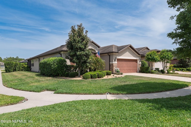 obstructed view of property featuring a garage, stucco siding, a front yard, and concrete driveway