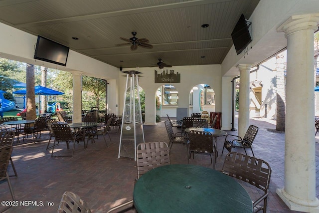 view of patio / terrace with a ceiling fan and outdoor dining space