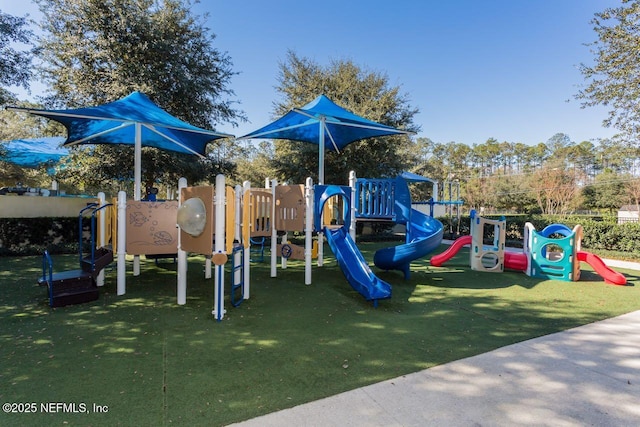 communal playground featuring a yard