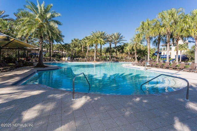 pool with a patio area