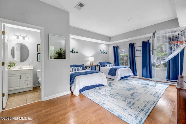 1104 Creekwood Way, Saint Johns, FL 32259 - bedroom with wood finished floors and connected bathroom