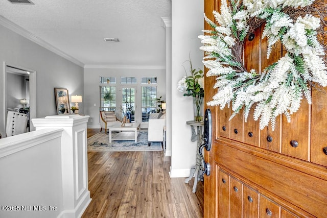 1104 Creekwood Way, Saint Johns, FL 32259 - entrance foyer with ornamental molding, hardwood / wood-style flooring, and a textured ceiling