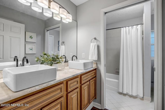 1104 Creekwood Way, Saint Johns, FL 32259 - bathroom with double vanity, shower / bath combo, tile patterned flooring, and a textured ceiling