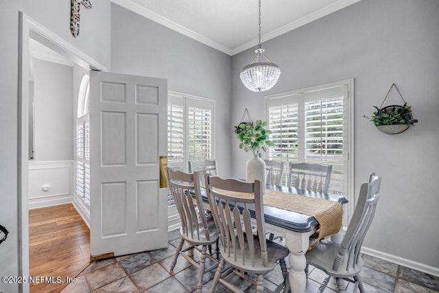 1104 Creekwood Way, Saint Johns, FL 32259 - dining room featuring crown molding, healthy amount of natural light, a chandelier, and stone finish flooring