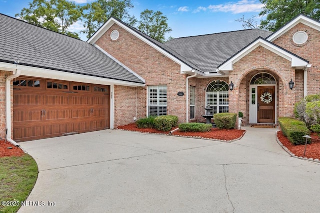 1104 Creekwood Way, Saint Johns, FL 32259 - traditional-style house with concrete driveway, an attached garage, and brick siding