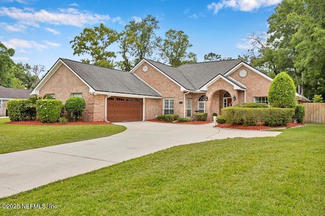 1104 Creekwood Way, Saint Johns, FL 32259 - traditional-style house with brick siding, an attached garage, and driveway