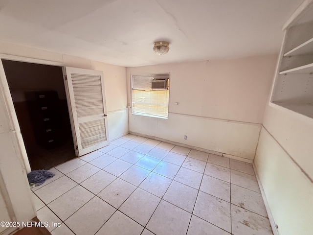 unfurnished bedroom with light tile patterned floors