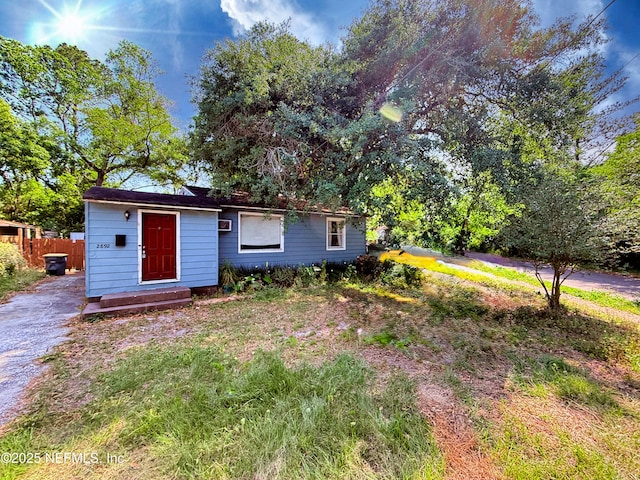 view of front of house featuring fence
