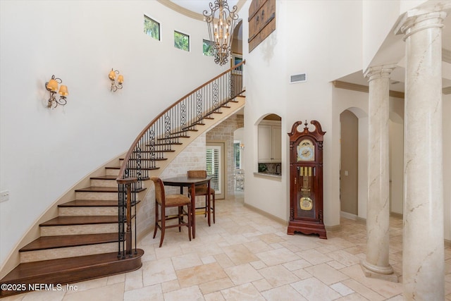 106 Villa Sovana Ct, Saint Johns, FL 32259 - foyer entrance featuring baseboards, visible vents, arched walkways, stairway, and a high ceiling