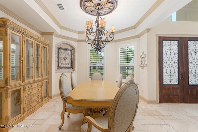 106 Villa Sovana Ct, Saint Johns, FL 32259 - dining space featuring stone tile flooring, french doors, ornamental molding, and a notable chandelier