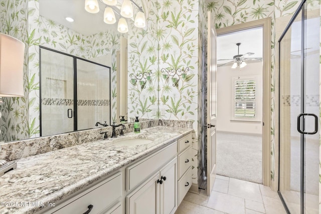 106 Villa Sovana Ct, Saint Johns, FL 32259 - full bath featuring vanity, a stall shower, a ceiling fan, baseboards, and wallpapered walls