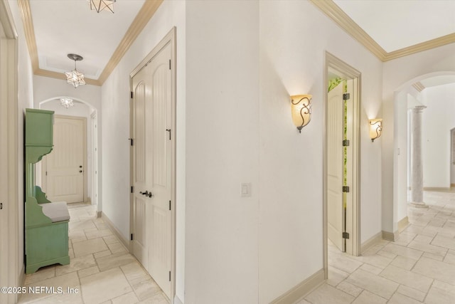 106 Villa Sovana Ct, Saint Johns, FL 32259 - corridor with crown molding, baseboards, and arched walkways