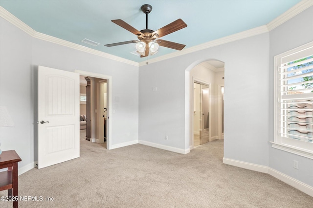 106 Villa Sovana Ct, Saint Johns, FL 32259 - unfurnished room with crown molding, visible vents, ceiling fan, arched walkways, and light colored carpet