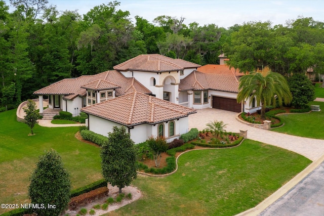 106 Villa Sovana Ct, Saint Johns, FL 32259 - view of front of property with driveway, a tile roof, a garage, stucco siding, and a front lawn