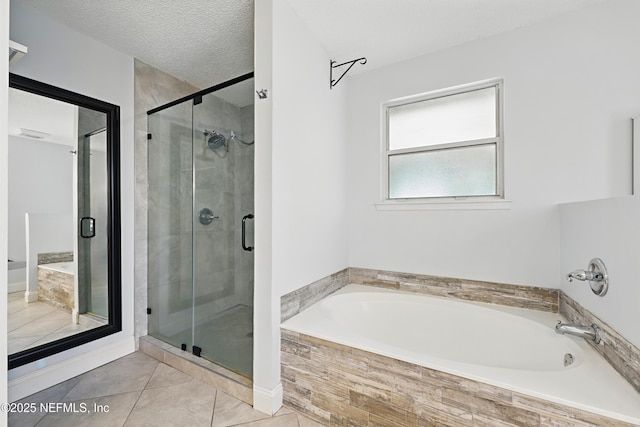 full bathroom with tile patterned floors, a garden tub, and a shower stall