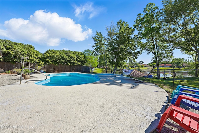view of swimming pool featuring fence, a patio area, and a fenced in pool