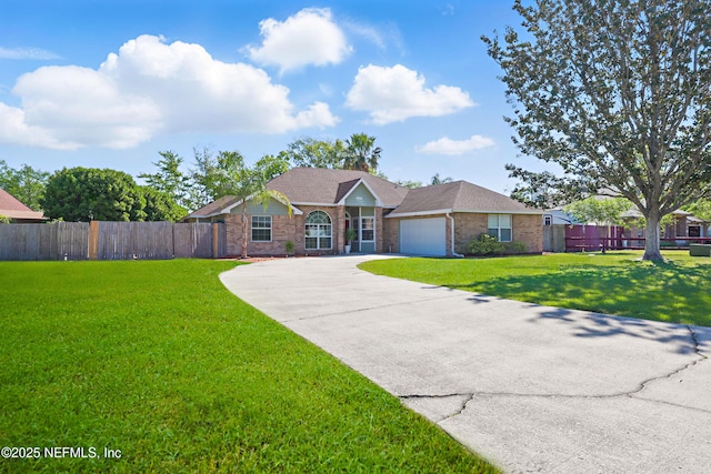 ranch-style home with fence, concrete driveway, brick siding, a front yard, and a garage